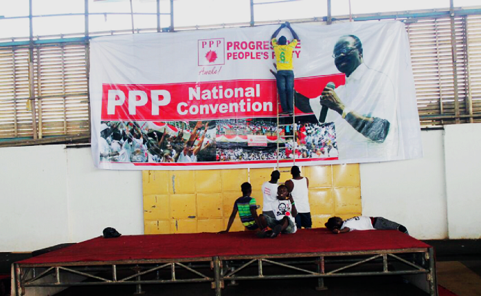 Workers mounting banners for the event